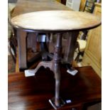 A 19th century oak oval tripod table