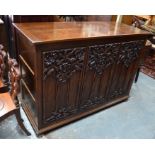 A substantial late 19th century oak coffer, the jointed frame with cleated and hinged top over