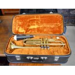 A Boosey & Hawkes trumpet in case c/w P&H London mute in case
