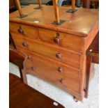 Antique stained pine chest of two short over two long drawers with turned pulls raised on bracket