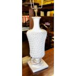 A white glazed reticulated lamp base
