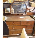 A mahogany dressing chest with two short over two long drawers raised on a plinth base