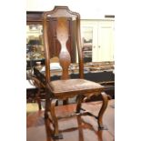 An inlaid walnut high back hall chair with shaped supports and turned stretchers