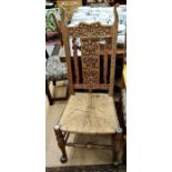 A carved oak side chair with rush seat to/w a three tier caned mahogany stand (2)