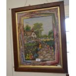 A mahogany framed wool tapestry picture of a house in a cottage garden setting, to/w a rectangular