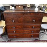 A Regency mahogany secretaire chest with, the fall front top drawer enclosing a fitted interior over