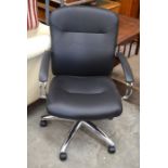 A black leatherette and chromed adjustable office chair on five-star base