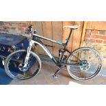 A Canyon Nerve high specification full-suspension mountain bike with black carbon fibre frame [
