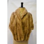 A smoky shadowed taupe mink evening cape with lining stitched 'Emilio Gucci'Good worn condition.