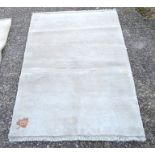 A handmade thick piled cream wool Gabbe rug 150 x 100 cm [650]