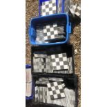A quantity of fired Earth black & white chequered tiles, each 20 cm x 20 cm, approx. 126 contained