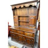 A good quality oak Shropshire dresser, the raised back fitted with open shelves, cupboards and small