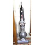 A Dyson Cinetic Big Ball Animal vacuum cleaner and tools