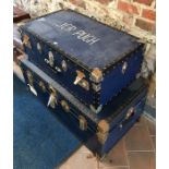 A blue school type trunk to/with another smaller blue trunk (2)