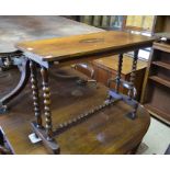 A Victorian mahogany side table with rectangular top raised on bobbin turned supports with stretcher
