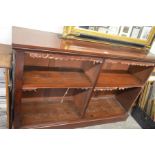 A 19th century mahogany bookcase with two shelves, raised on a plinth base