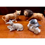 Beswick models of a lion and lioness to/w a Nao seated donkey and Puppies at play (4)