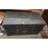 A large antique stained pine and iron bound storage chest