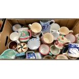 A box of contemporary mugs including Emma Bridgewater