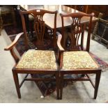 A set of six mahogany dining chairs with fret cut backs and tapestry style floral upholstery -