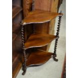 A small mahogany three tier corner whatnot with barley twist supports