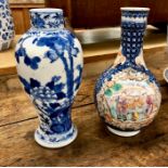 A Chinese Export, famille rose, bottle vase, decorated with Manchu/Chinese scholars, Qianlong;