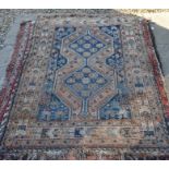 Old Persian Shiraz rug with geometric design on navy ground within repeating borders 154 x 106 cm