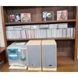 An Aiwa Super T-Bass digital audio system XS-G5 with speakers and a large collection of popular