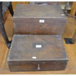 Two antique oak boxes (one with key) containing a part manicure set, decimal coinage sets etc. (2)