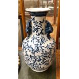 A Chinese style blue and white vase, decorated with birds and peaches