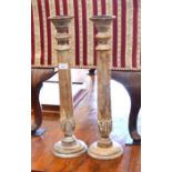 A pair of limed wood candle prickets