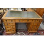 Victorian Gothic oak style pedestal desk, the top with inset tooled leather top over an