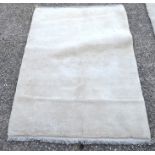 A handmade thick piled cream wool Gabbe rug 140 x 95 cm [648]