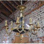 A good French Empire style ormolu circular chandelier, suspended from a centre spreading palm over