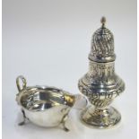 An Edwardian silver baluster sugar caster in the Georgian manner, with embossed writhen