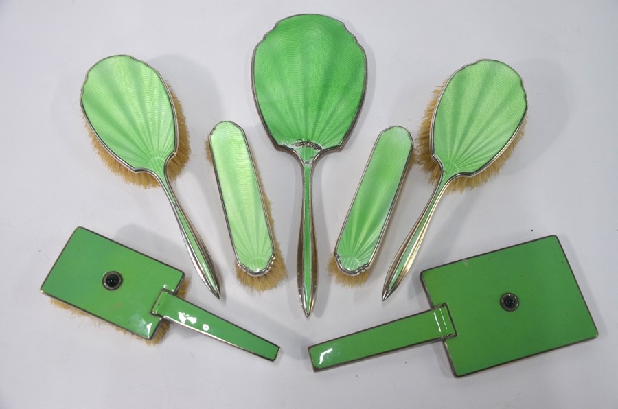 A silver and green basse-taille enamel five-piece brush set, Atkin Bros., Birmingham Jubilee