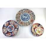 Three Japanese Imari dishes, comprising: one decorated with fan-shaped panels of Natural History