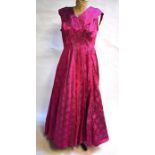 A 1950s bright pink/blue floral brocade evening dress, 48 cm across chest and an aquamarine