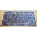 An old Persian Saruk small rug, dark salmon ground, 146 cm x 64 cm