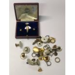 A cased set of 18ct and mother of pearl dress studs in fitted leather box retailed by Edward to/w