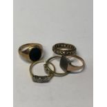 Five various rings including a 9ct yellow gold gent's signet ring set onyx, yellow metal signet