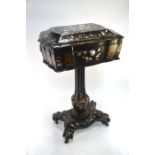 A Victorian mother of pearl and gilt decorated papier mache work table, the hinged top enclosing a