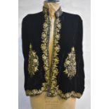 A vintage black silk velvet evening cape heavily embroidered with metallised thread and silk