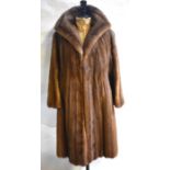 A lady's shadowed taupe mink coat with scalloped hem, retailed by Eric's Furriers, Southampton, 53