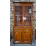 A late 19th/20th century mahogany chiffonier bookcase, with pair of glazed cabinet doors over two
