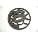 A Japanese iron tsuba with integral sekigane in the nakago-ana, decorated in yo-sukashi with three