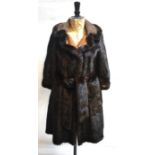 A customised dark brown mink fur coat with suede mink trimmed collar and tie-belt, 50 cm across