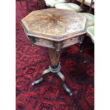 A Victorian boxwood inlaid rosewood work table, the octagonal top enclosing the original paper and