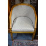 Linley Workshop, a walnut tub chair with alternating beige/gold check upholstery, bears makers label