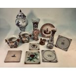 A collection of continental tin glazed earthenware - Dutch and French including five Delft tiles (